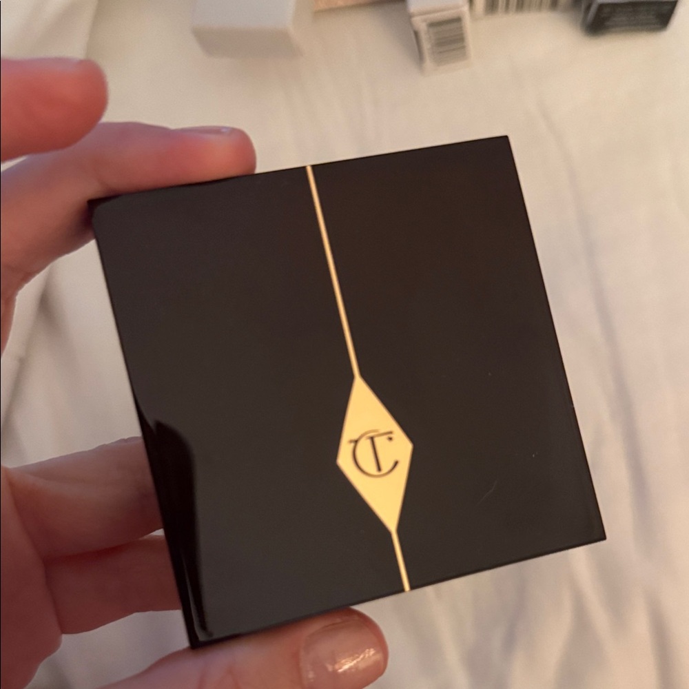 Charlotte Tilbury Sleek Black Compact with Gold Detail